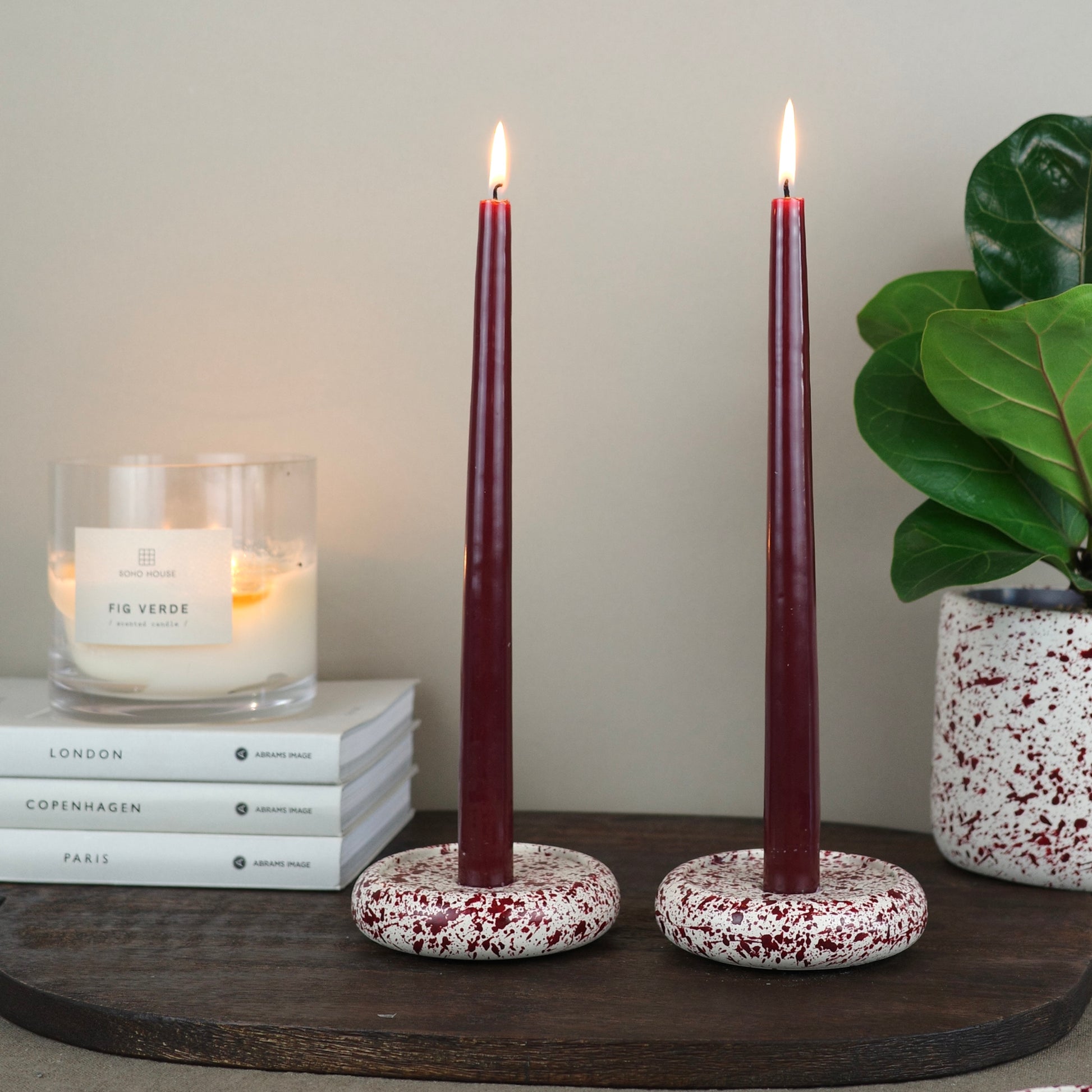 Burgundy paint splattered on a cream concrete circle shaped candleholder, stackable, pair