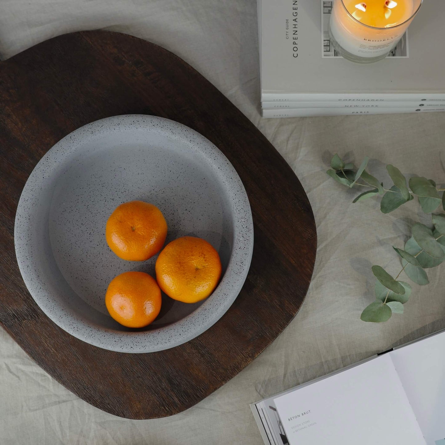 Grey round eco concrete fruit bowl on a table 