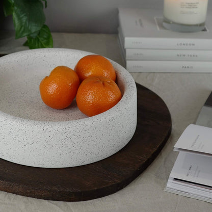 White round eco concrete fruit bowl on a table 